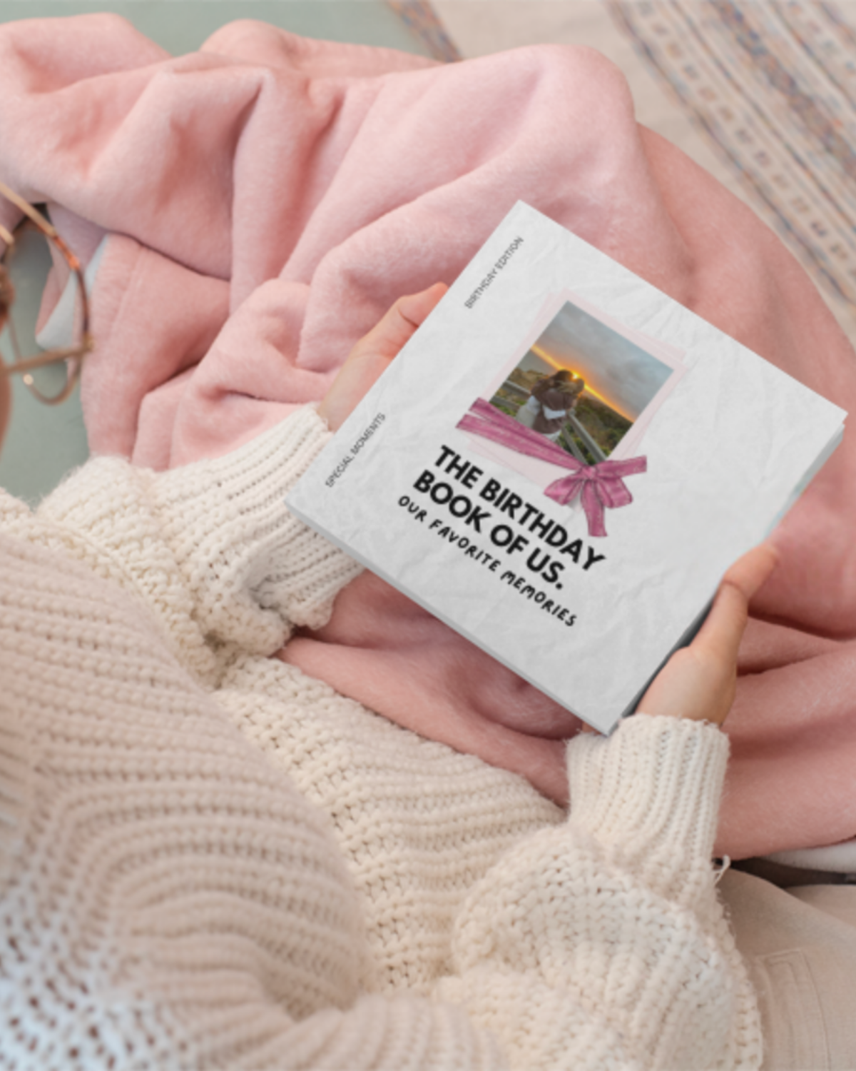 Personalized birthday book resting on a pink blanket